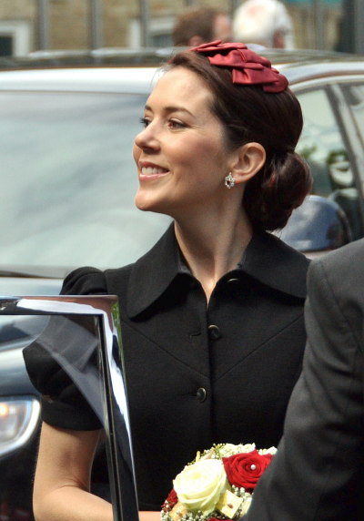 PrincessMary. And that is a hat on top of her hair.